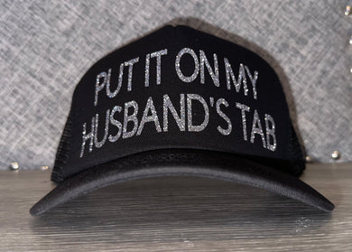 Put It On My Husband’s Tab Trucker Hat