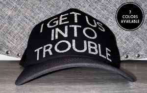 I Get Us Into Trouble Trucker Hat